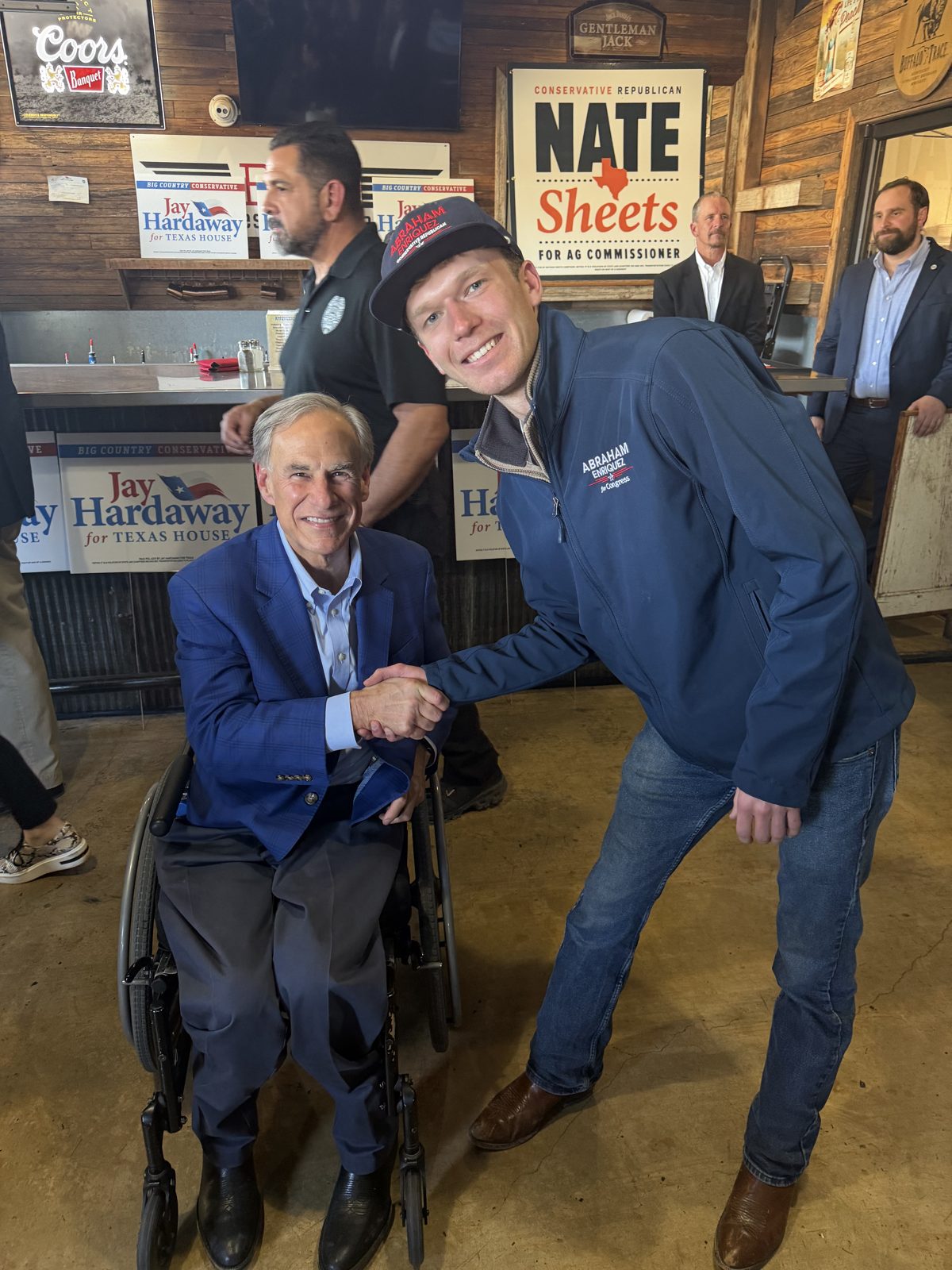 Aidan Isaac shaking hands with Governor Greg Abbott