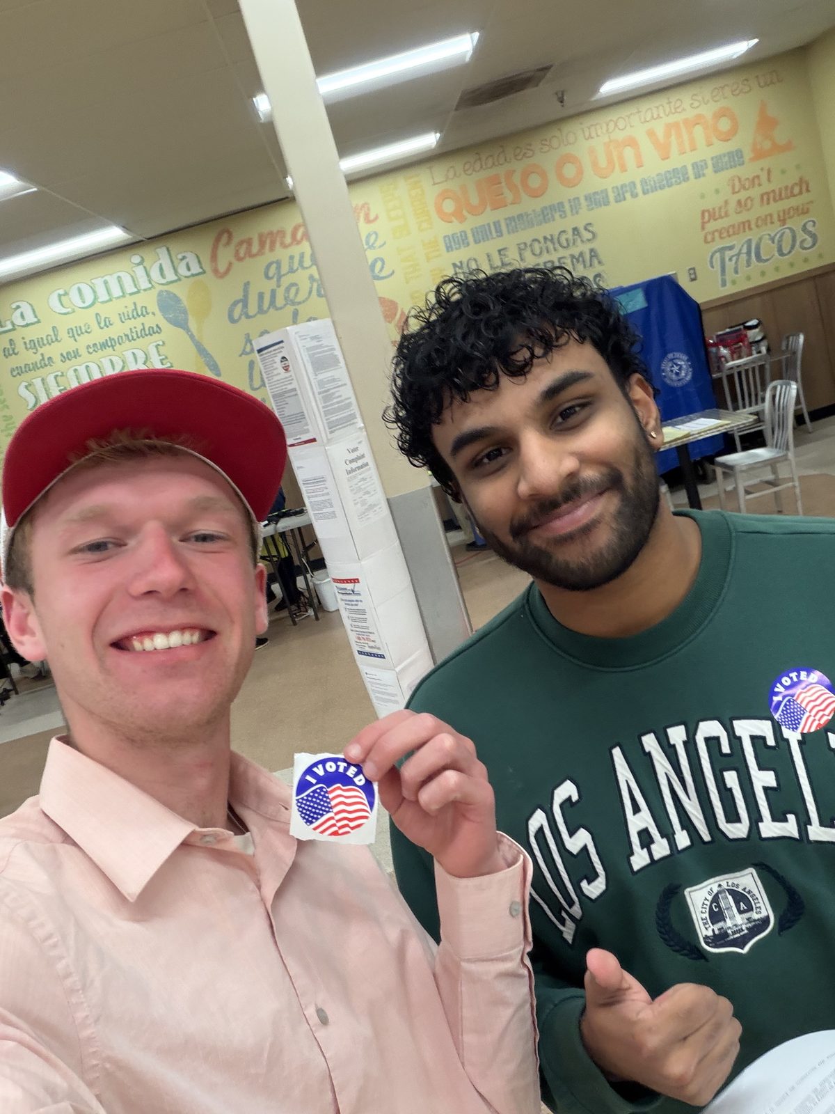 Aidan Isaac and a friend with I Voted stickers